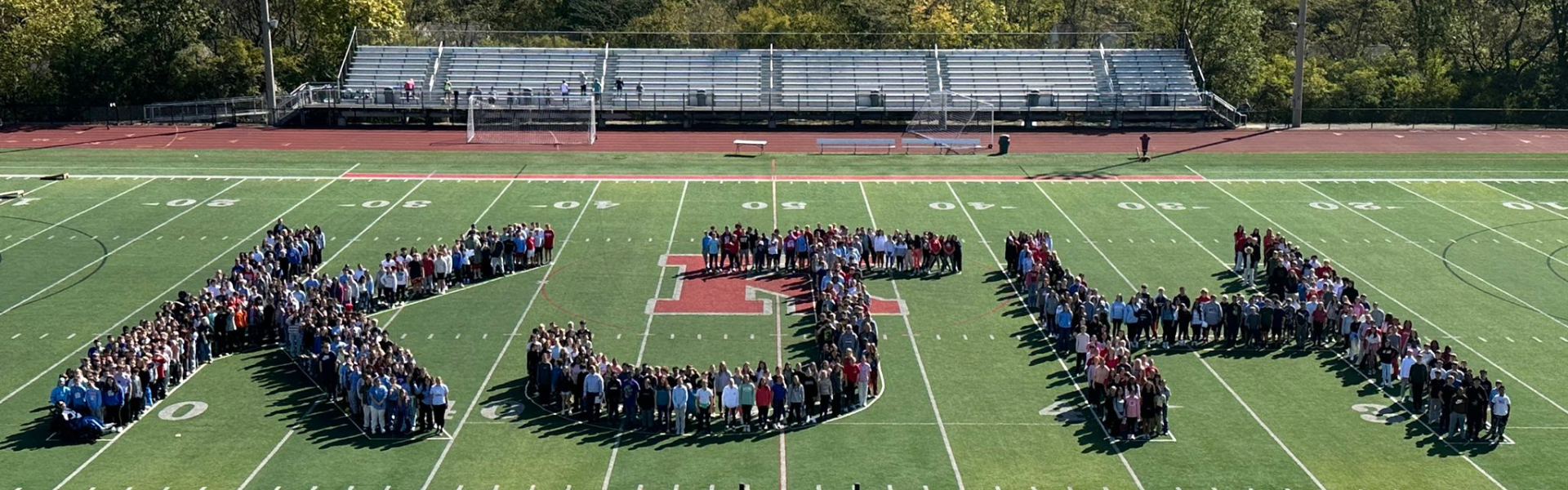 KJH student body spells KJH on the high school footbal stadium